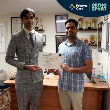 Dr Manu Bora Treating Patients 3