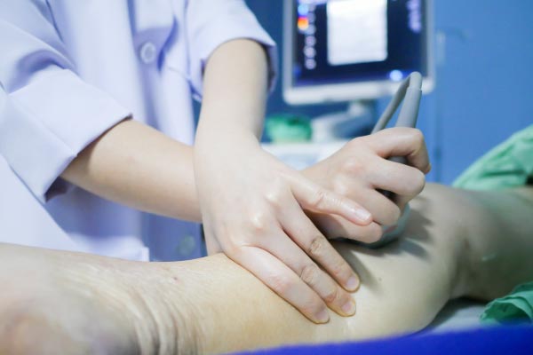 Doctor preparing to perform surgery for deep vein thrombosis