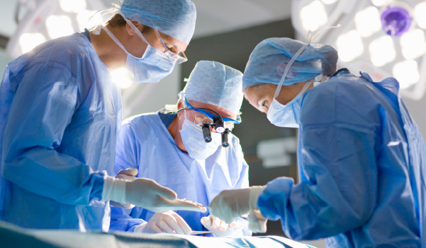 Doctor holds an X-ray picture in the background of a patient with inflamed adenoids.