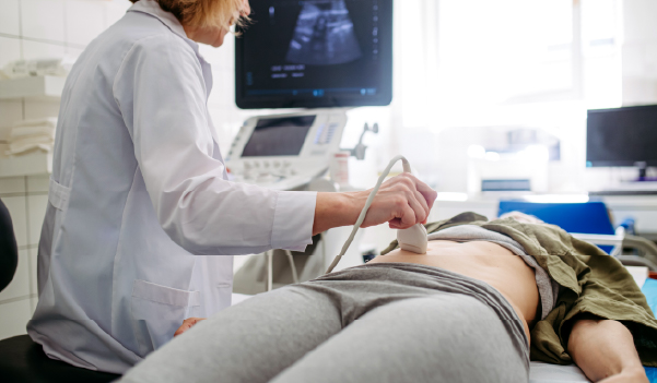 Female consulting gynecologist for pelvic pain treatment.