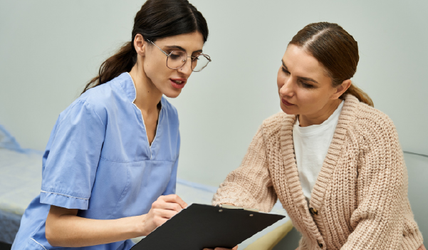 Female consulting gynecologist for vaginal discharge treatment