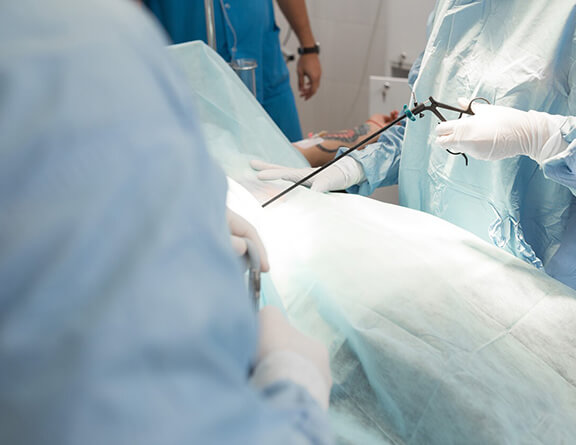 Surgeons performing vaginal cyst surgery